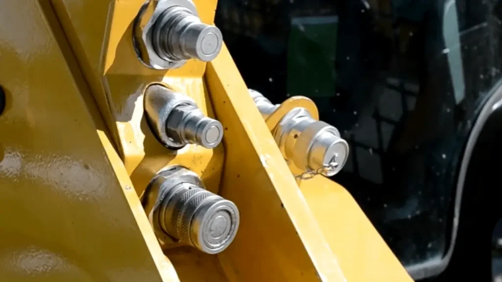 hooking the hydraulic hoses on bobcat